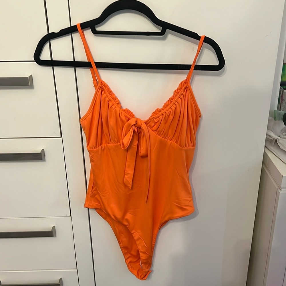 Orange bodysuit
